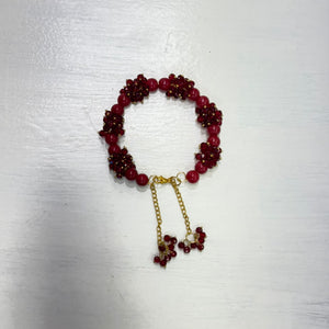 Burgundy stone pearls gajra with clustered beads and gold-tone hanging tassels