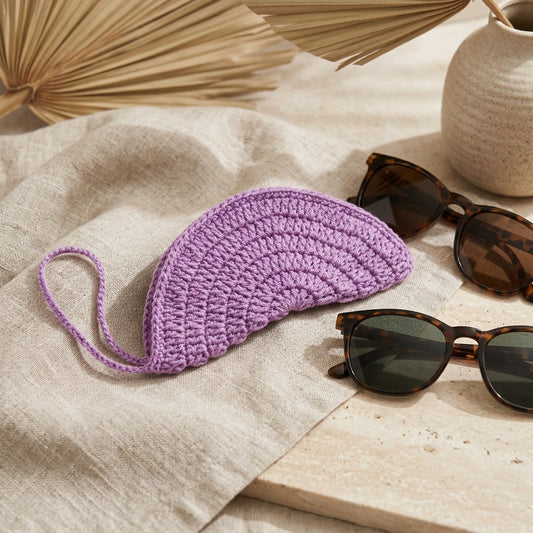 Crochet Sunglasses Cover — Hero. Styling props are not included. NovoBiz 698448fe-5171-481b-9a5f-575e90ad9310